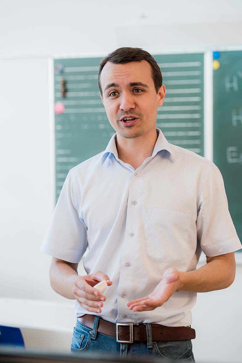 young-teacher-near-chalkboard-in-school-classroom-2021-04-02-19-33-07-utc.jpg